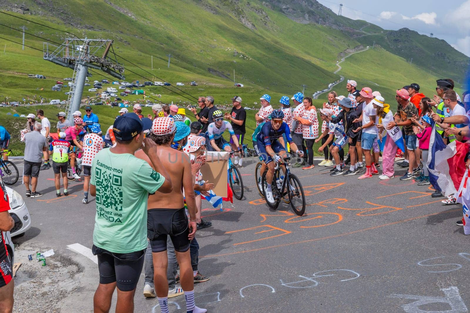 Col du Tourmalet, France - July 06 2023: Riders climbig the road to Col du Tourmalet in Pyerenees mountains during the stage 6 of Le Tour de France 2023.