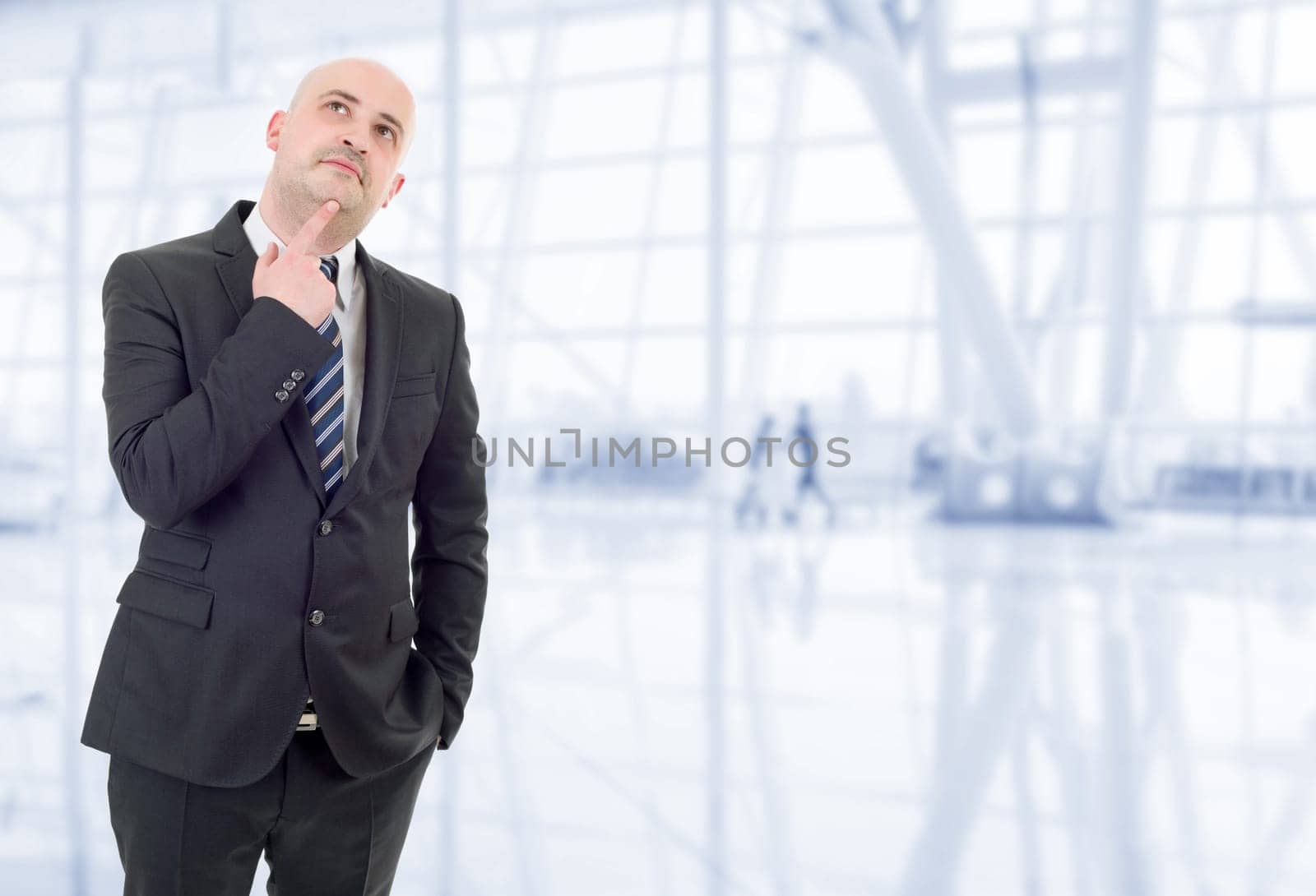 young business man thinking, at the office