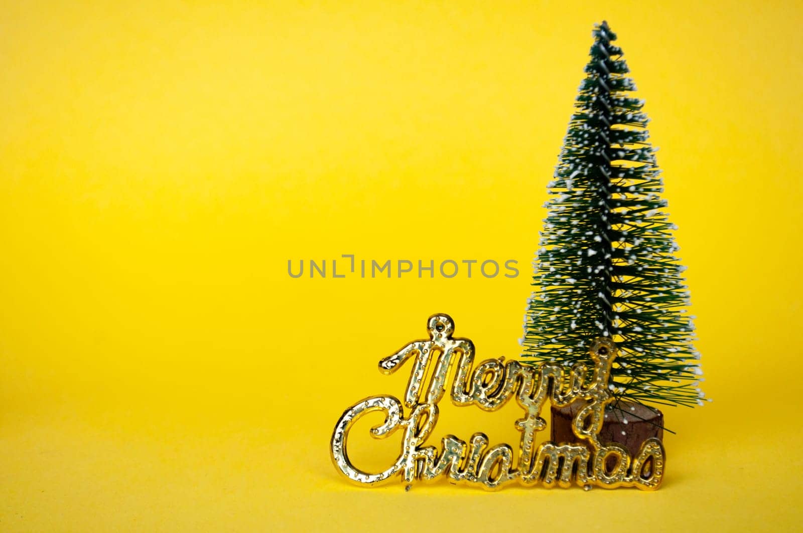 Merry Christmas wishes and Christmas tree on yellow cover with customizable space for text.