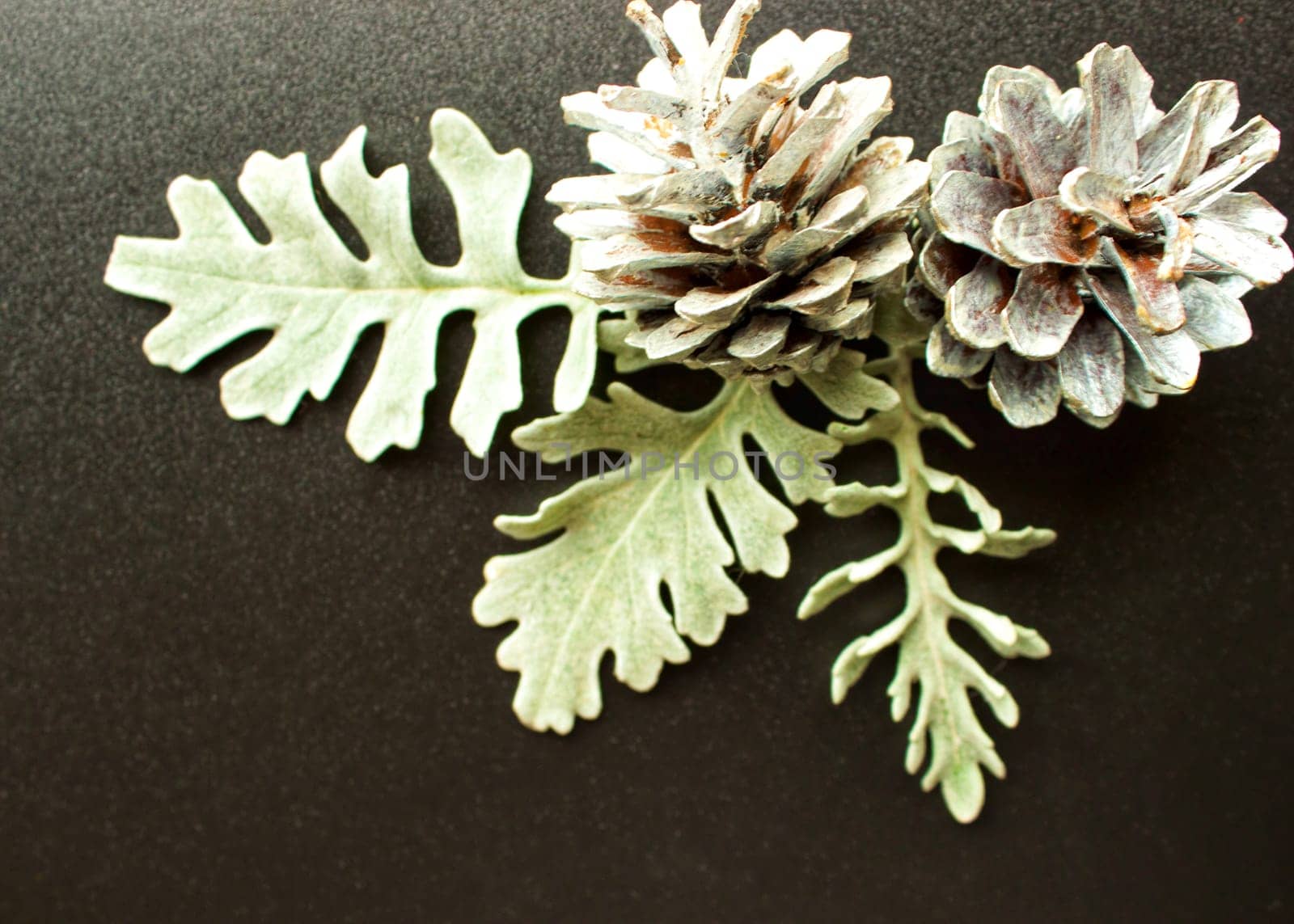 New Year's silver decorations on a black background with space for text