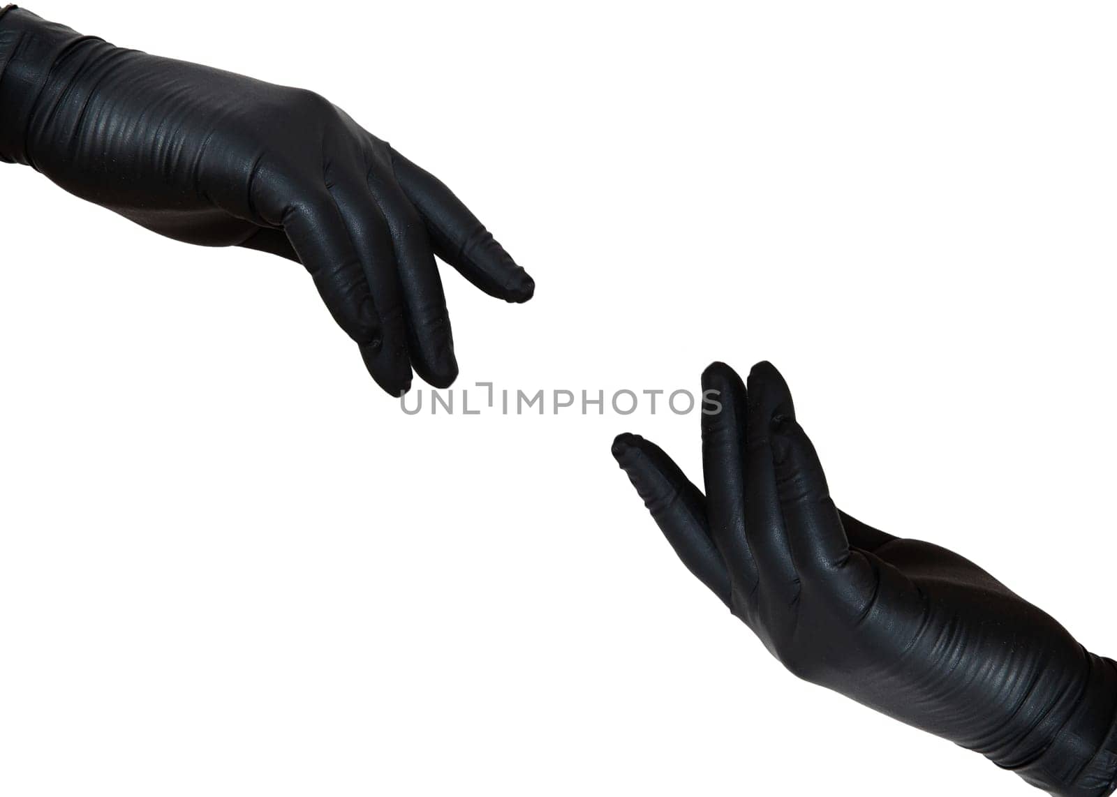 Two hands in sterile gloves stretch to each other. Hands in black nitrile gloves. Skin protection during epidemics and quarantine. There is a place for text. High quality photo