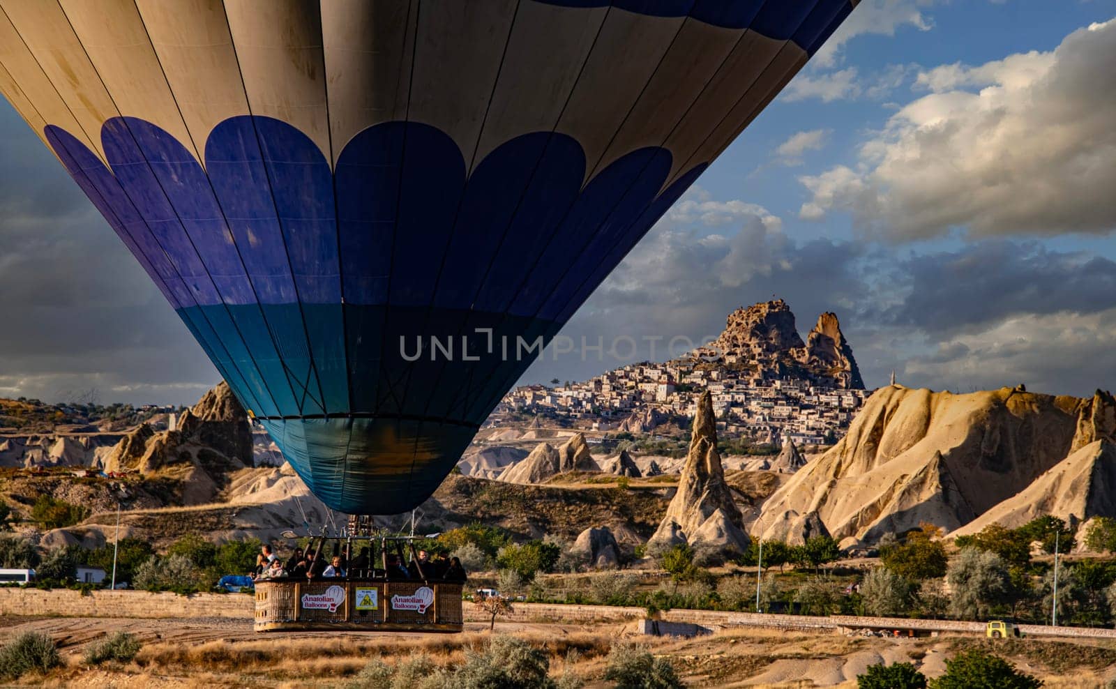 CAVUSIN, TUR - OCT 16, 2023: Hot air balloons near Cavusin in Goreme National Park in Cappadocia, Turkey.