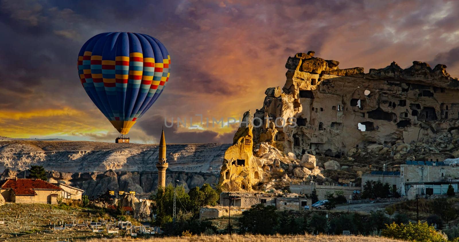 Hot air balloons near Cavusin in Goreme National Park in Cappadocia, Turkey.