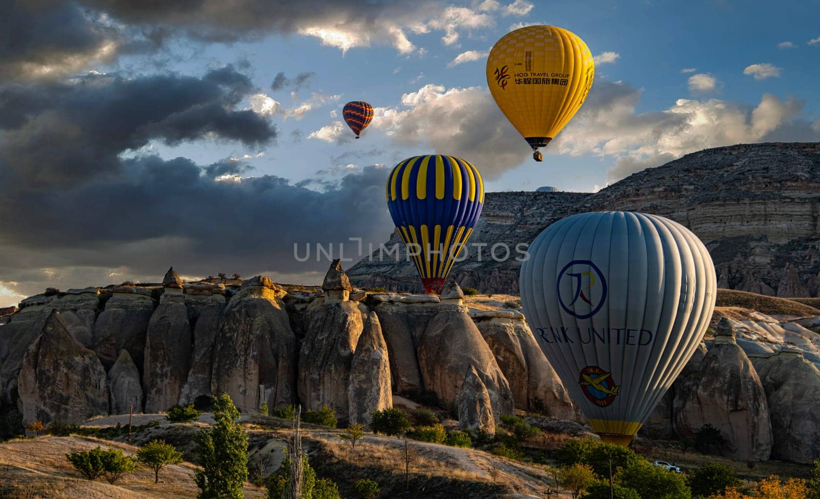 CAVUSIN, TUR - OCT 16, 2023: Hot air balloons near Cavusin in Goreme National Park in Cappadocia, Turkey.