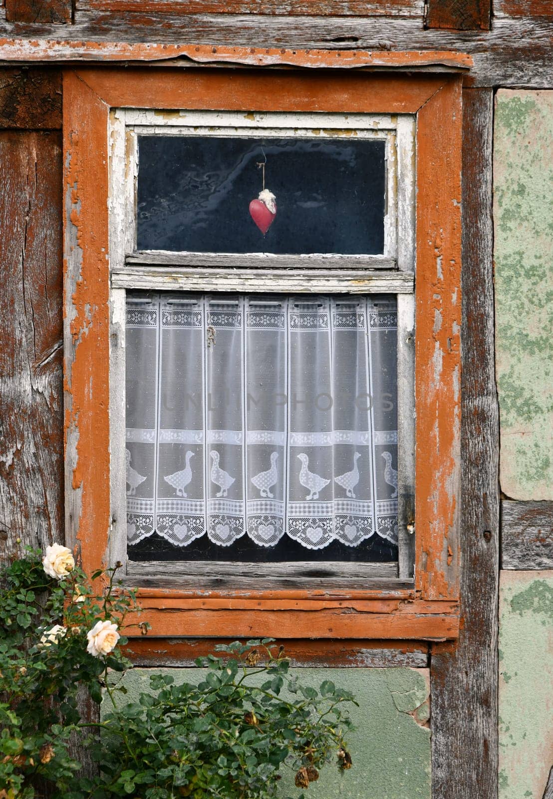 empty half-timbered house with panel curtains