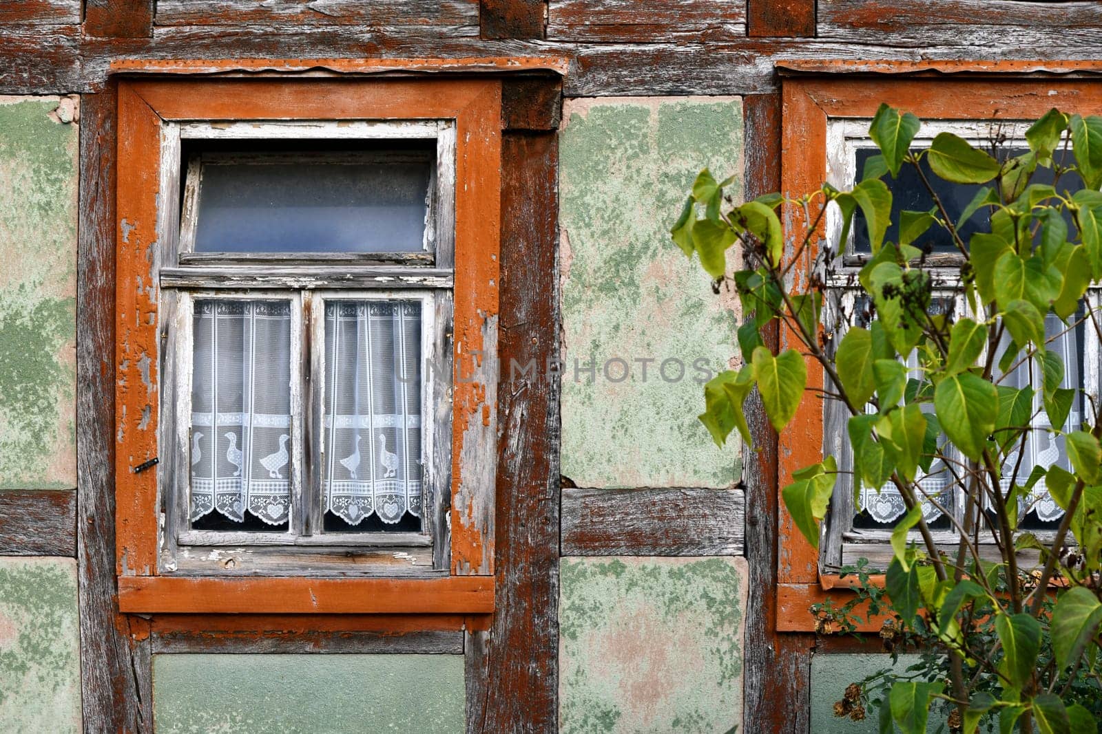 empty half-timbered house with panel curtains