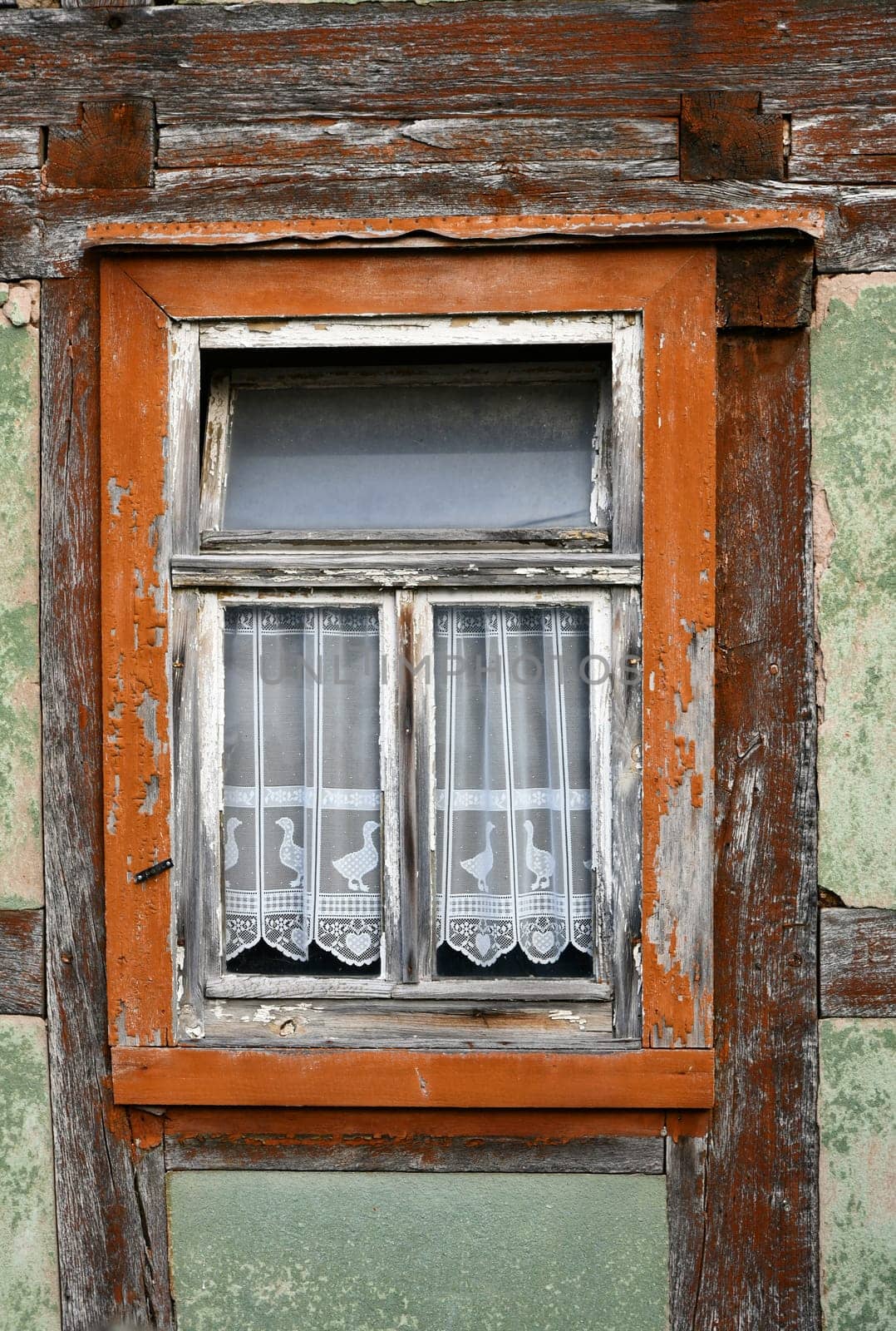 empty half-timbered house with panel curtains