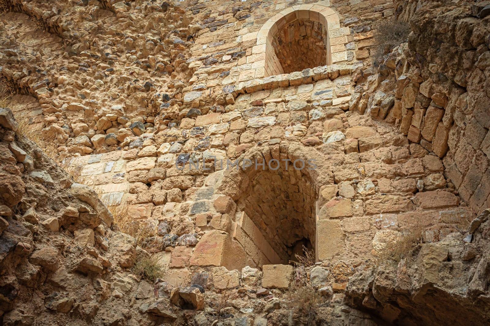 Interior of ruins of medieval Kerak Castle. Edited as a vintage photo. Jordan.