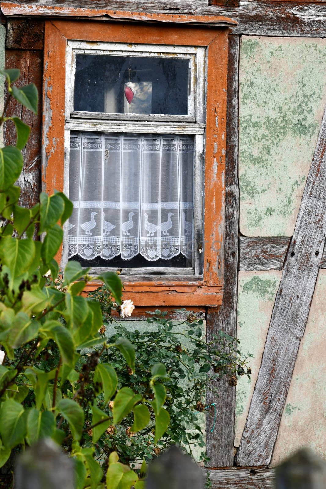 empty half-timbered house with panel curtains
