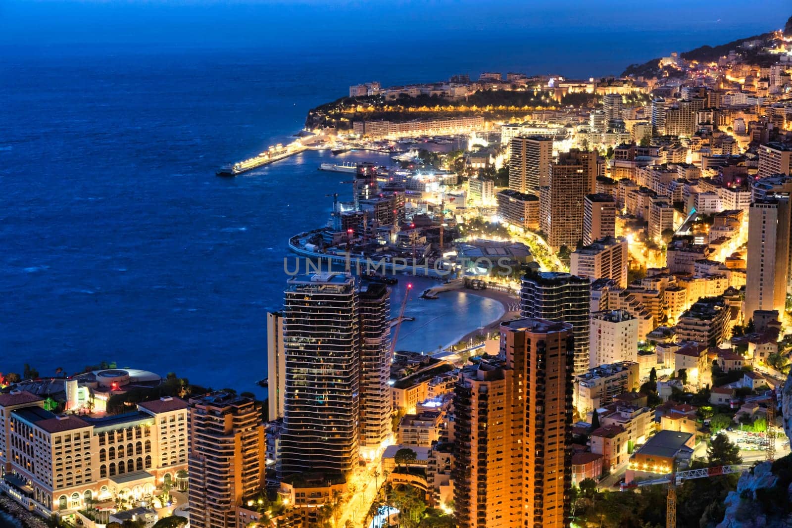 Monte Carlo panorama illuminated by night. Urban landscape with luxury architecture