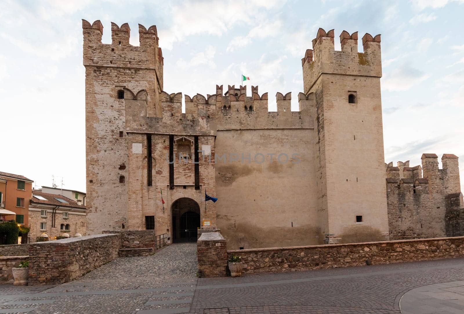 Sirmione, Italy - June 2022: Sirmione castle on Garda lake. Scenic mediaeval building on the water
