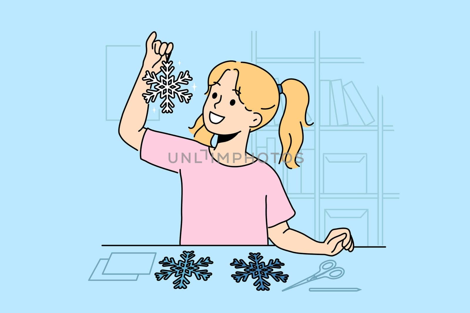 Little girl cuts out paper snowflakes preparing handmade christmas decorations for home on eve of new year. Child stands near table with scissors demonstrating snowflake made with own hands