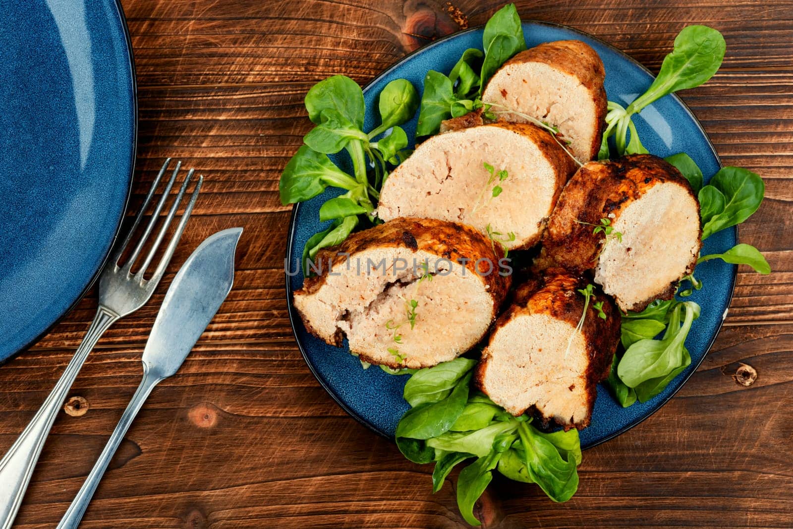 Roasted cod roe on a plate. Seafood and fish dishes.