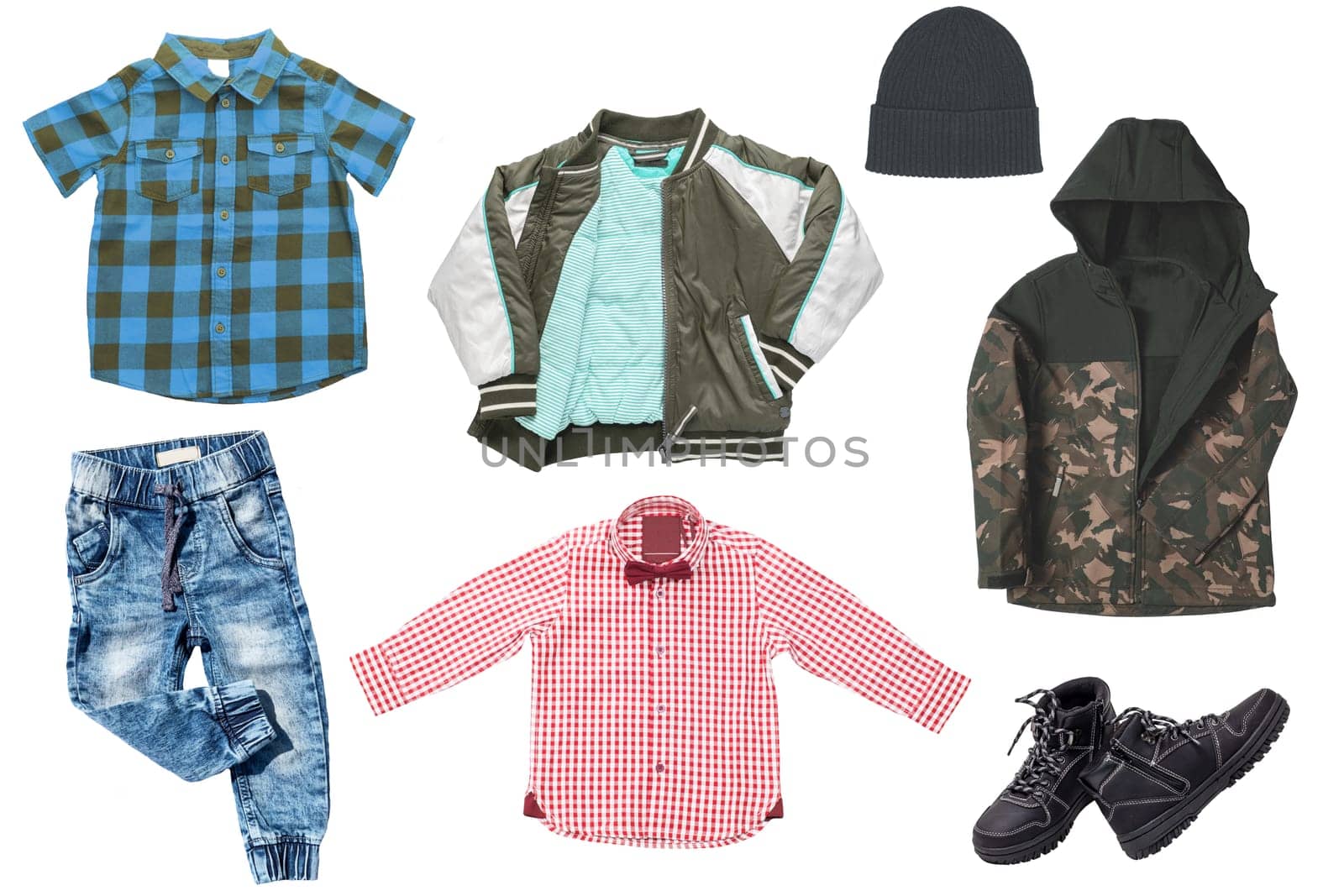Collage set of little boys autumn clothes isolated on a white background. Denim trousers and jacket, boots, a down jacket, pants and hood for child boy. Children's winter fashion.