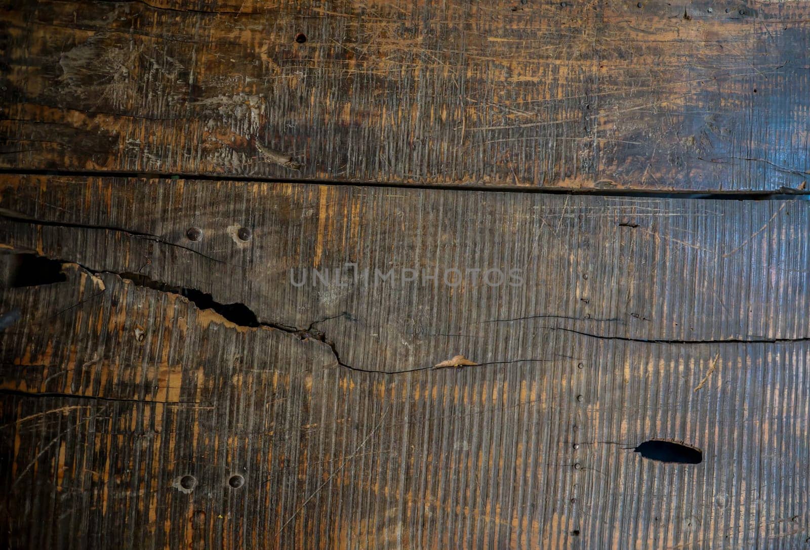 Wooden boards lying next to each other. A wooden texture made from several wooden boards.