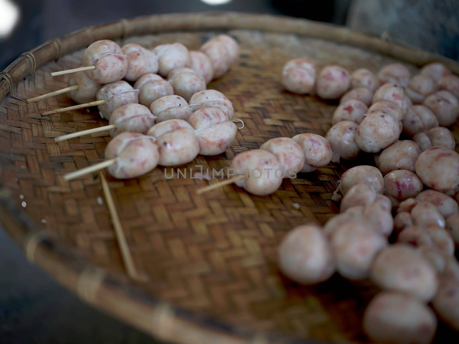 THAI ISAAN SAUSAGE. E-sarn sausages, Homemade sour sausages . Raw homemade pork meat sausages in skins with herbsand spices.