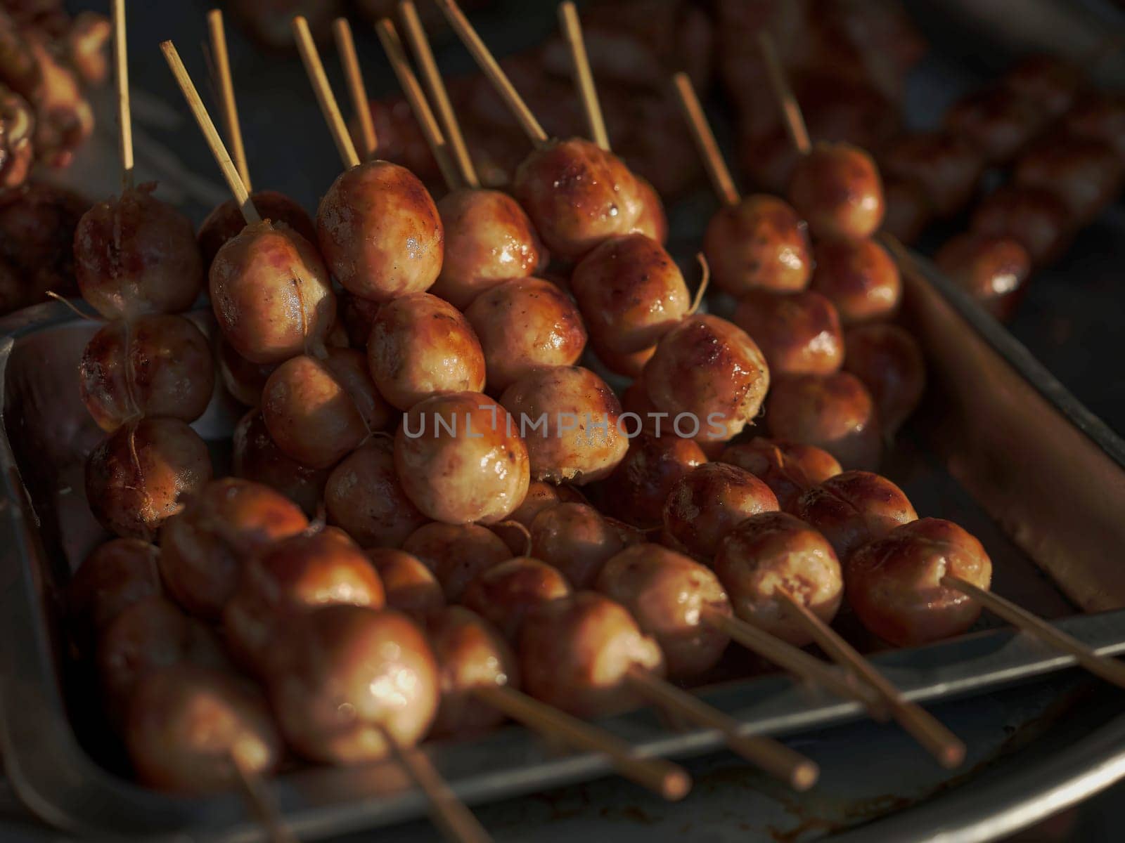 Thai street food in market. Isaan sausages.