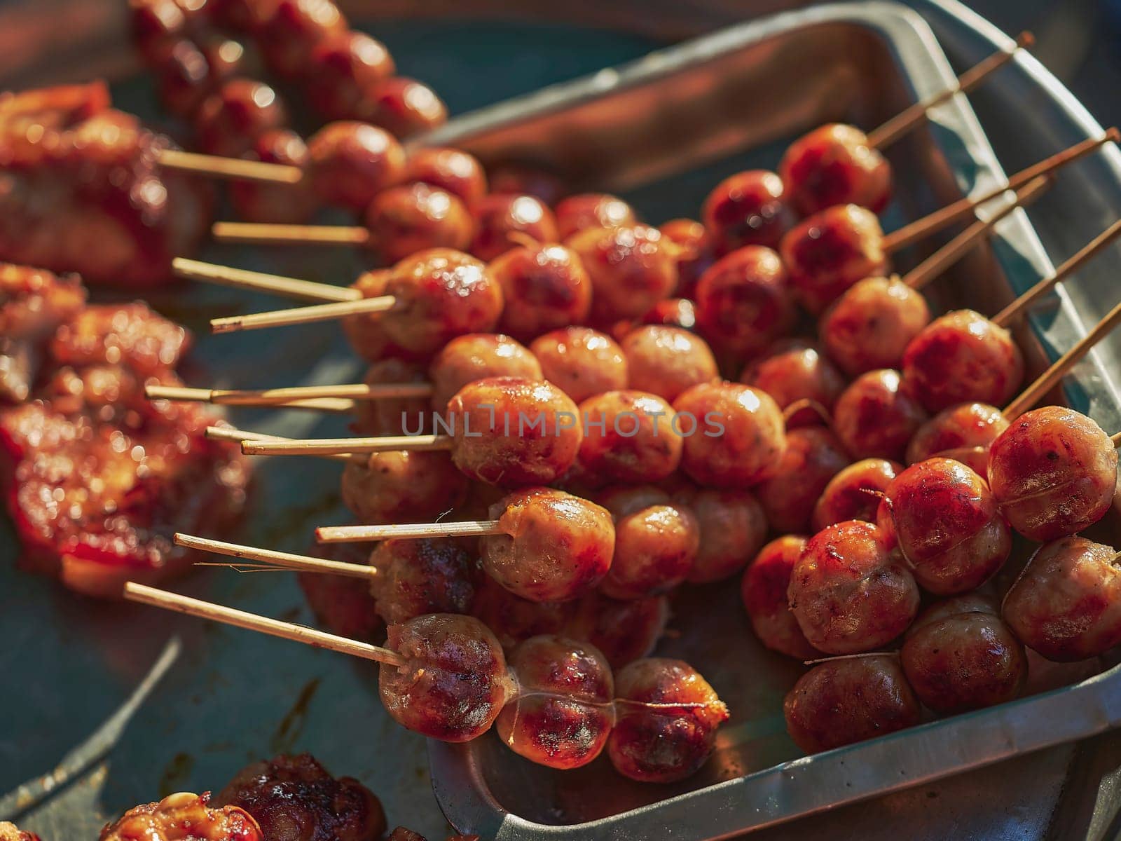 Thai street food in market. Isaan sausages.