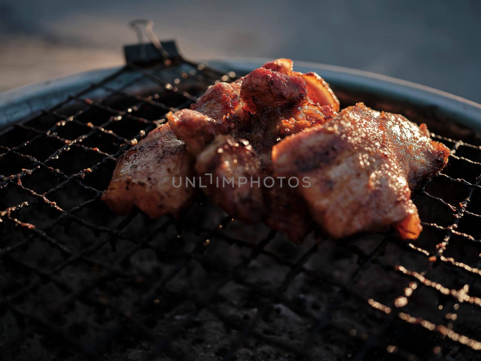 Thai street Food , Pork neck grilled  on the grill .