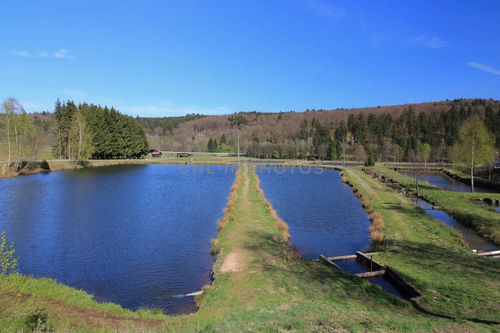 Partial view of a fish farming plant, blue sky in the background