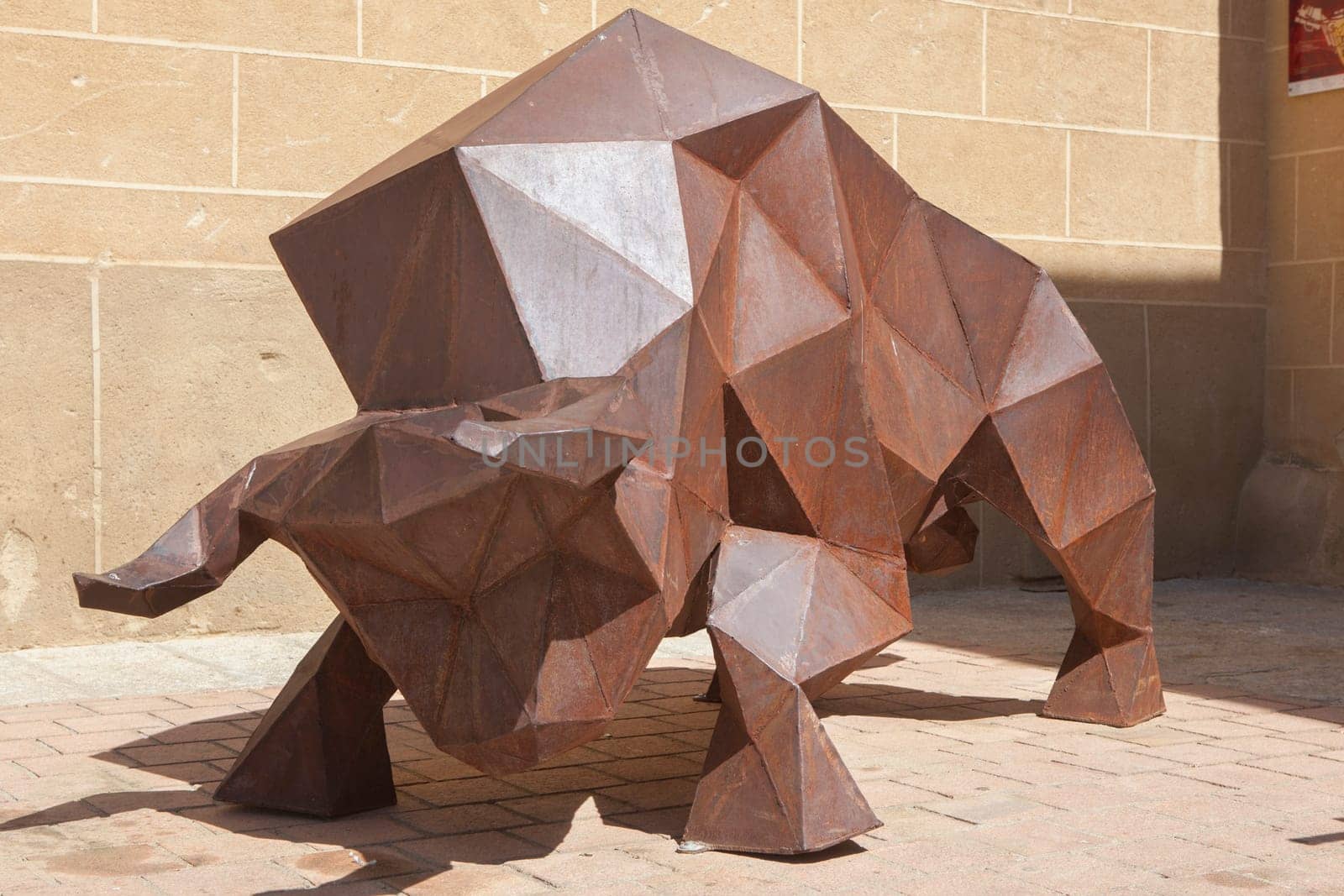 Coria, Spain - Sept 2nd, 2023: Cubist sculpture of bull, Coria, Spain. Unknown artist