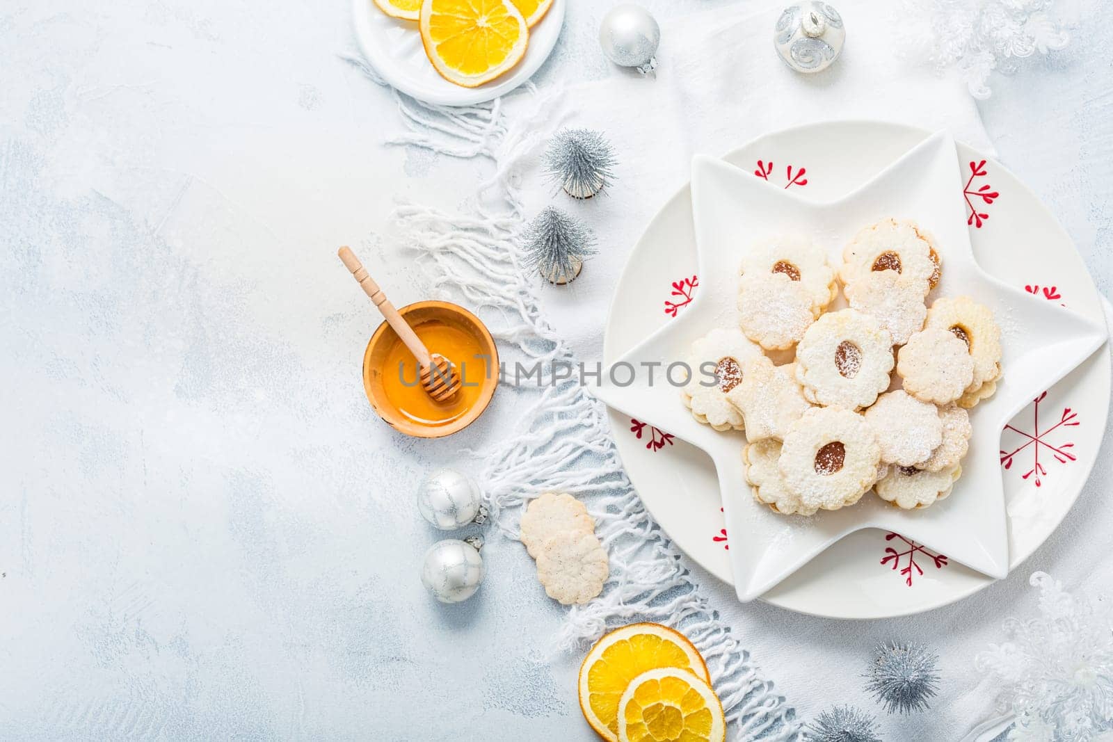 Homemade Christmas cookies with orange and honey.  Christmas decoration with ornaments.