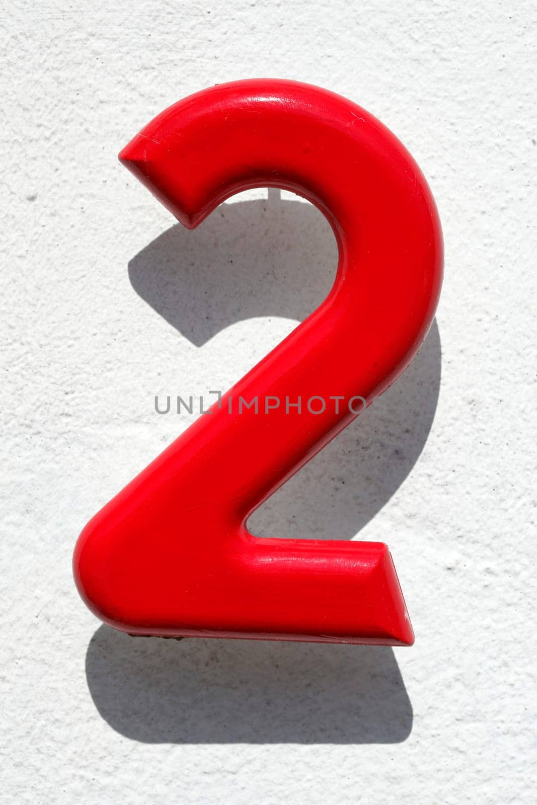 Red Naus license plate number 2 on white background, Germany