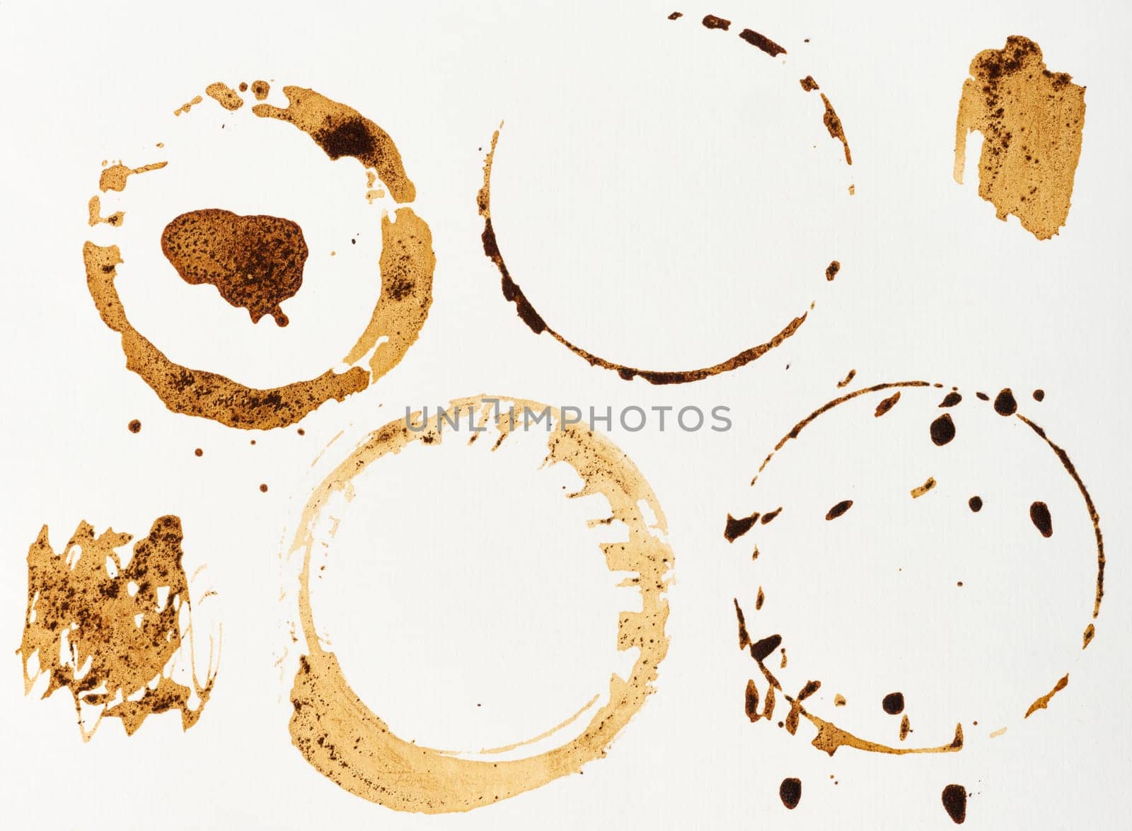 Imprint of spilled black coffee on a white isolated background, set
