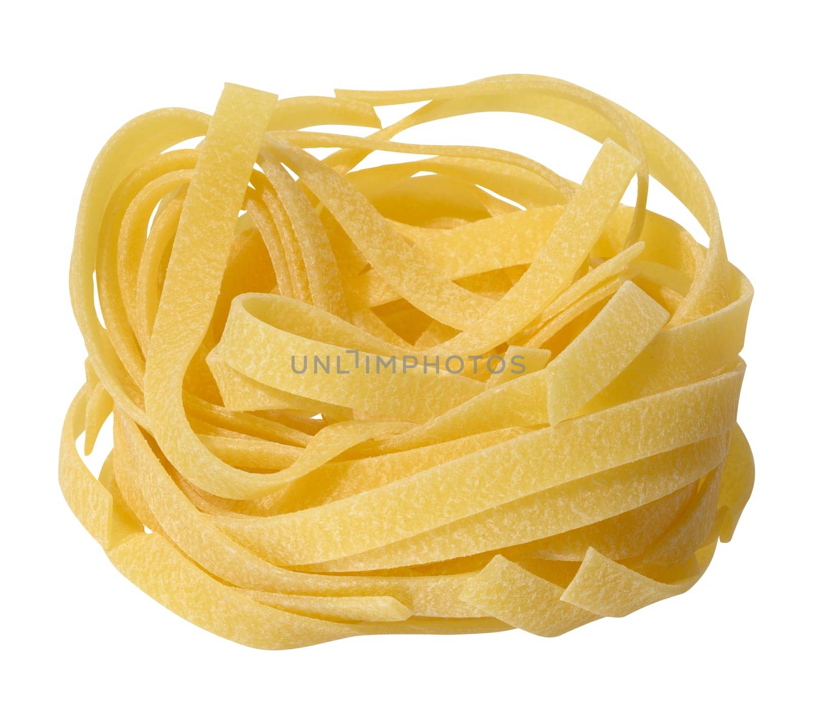 Twisted nest of raw pasta on white background