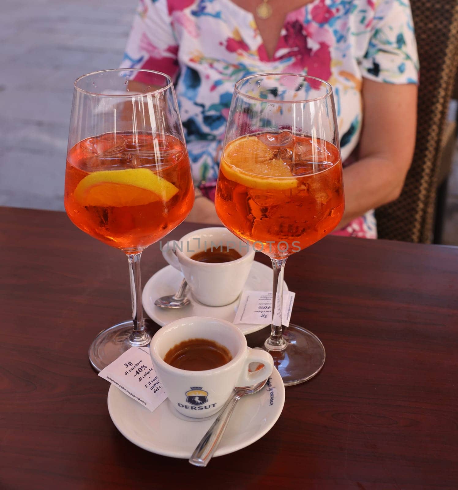 Venice, Italy - September 5, 2022: Two espressos and two Aperol Spritz - time to relax in Venice. Italy