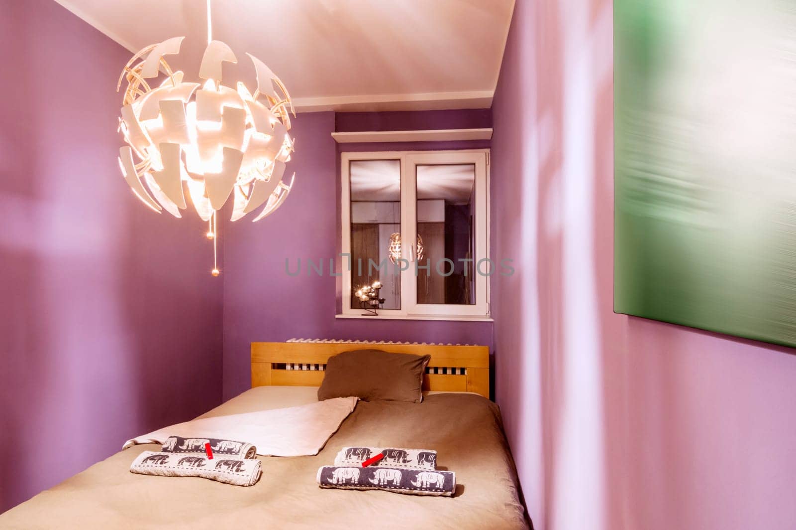Bedroom interior with bed and furniture of modern design.
