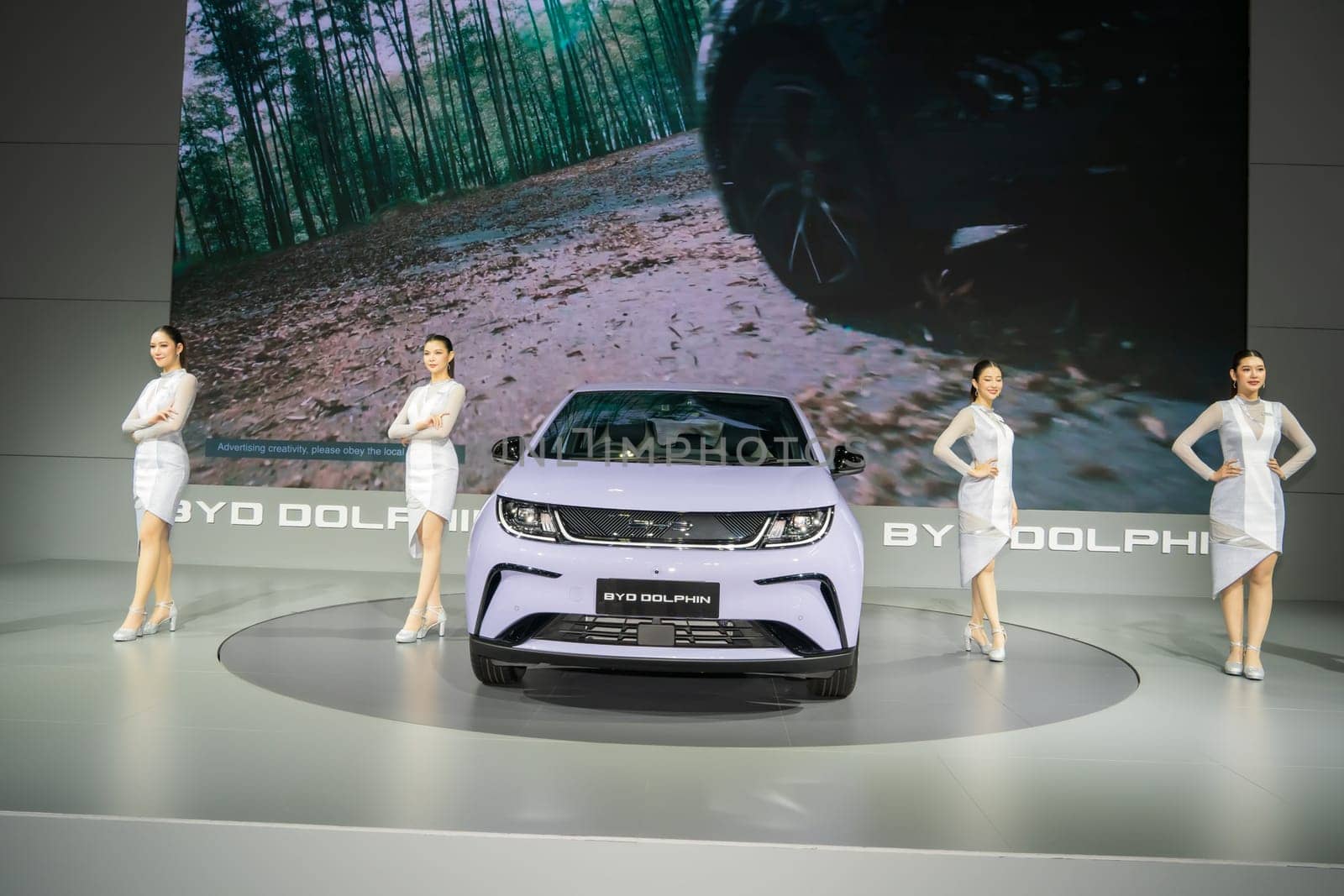 Nonthaburi, Thailand - APR 2, 2023 Unidentified model poses with a car at The 44th Bangkok international motor show 2023 at IMPACT Arena, Muang Thong Thani, Nonthaburi, Thailand.