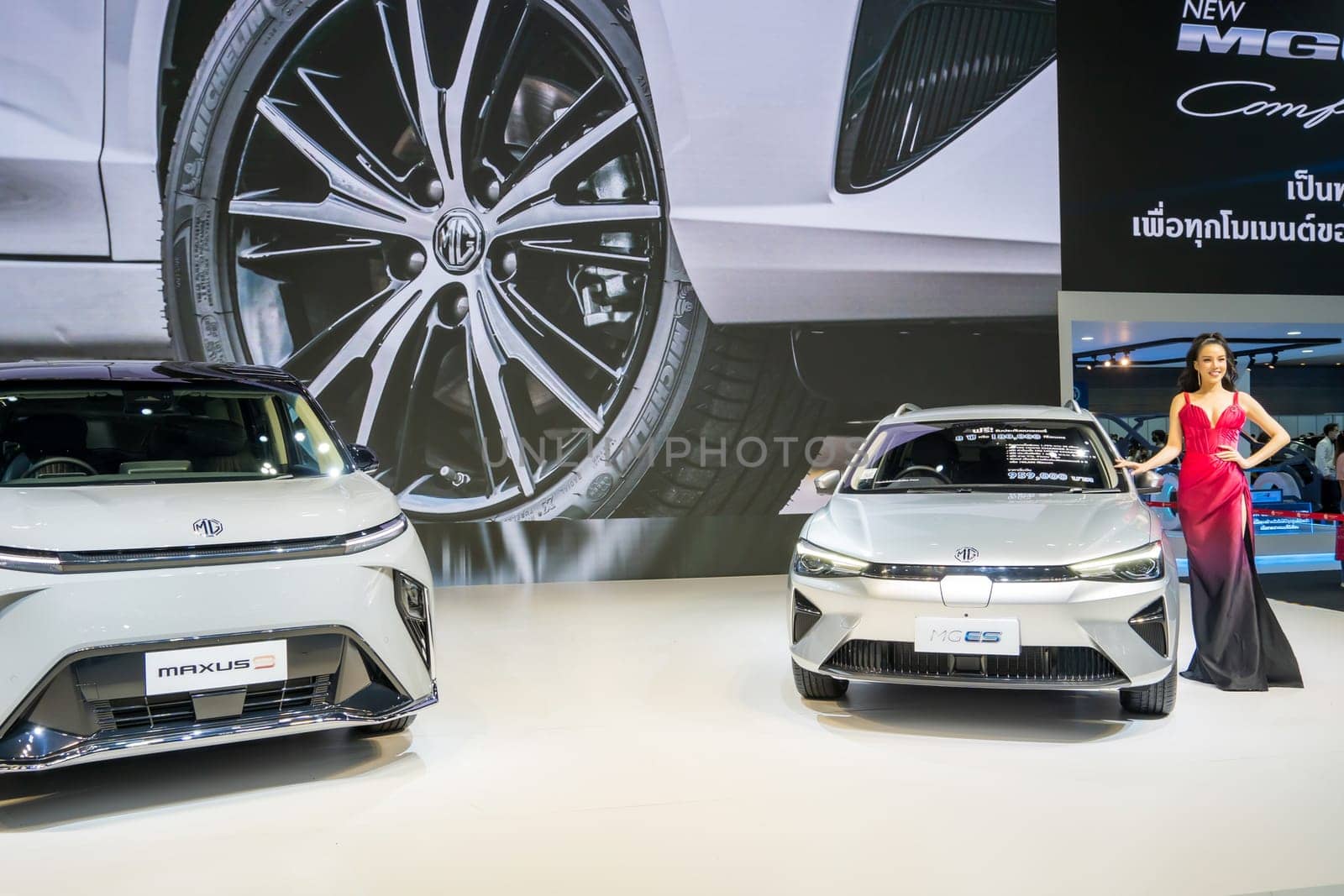 Nonthaburi, Thailand - APR 2, 2023 Unidentified model poses with a car at The 44th Bangkok international motor show 2023 at IMPACT Arena, Muang Thong Thani, Nonthaburi, Thailand.