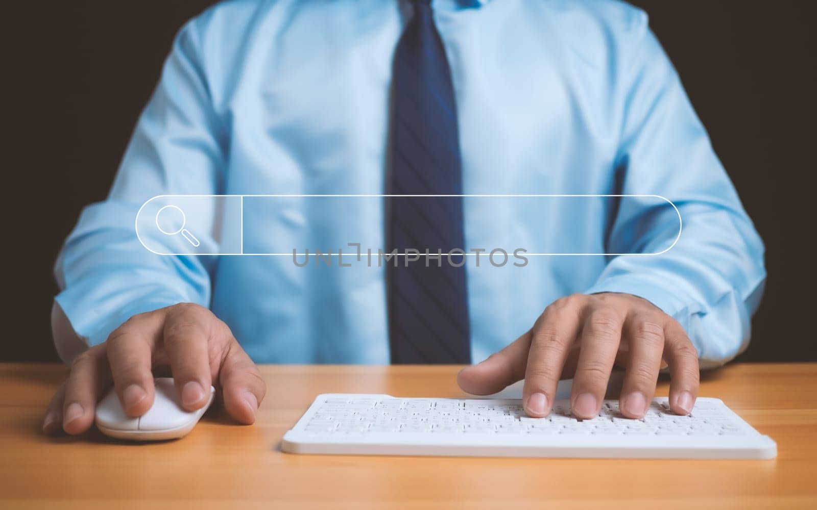 Human hand working on computer and search icon. The concept of searching for information from the internet network.