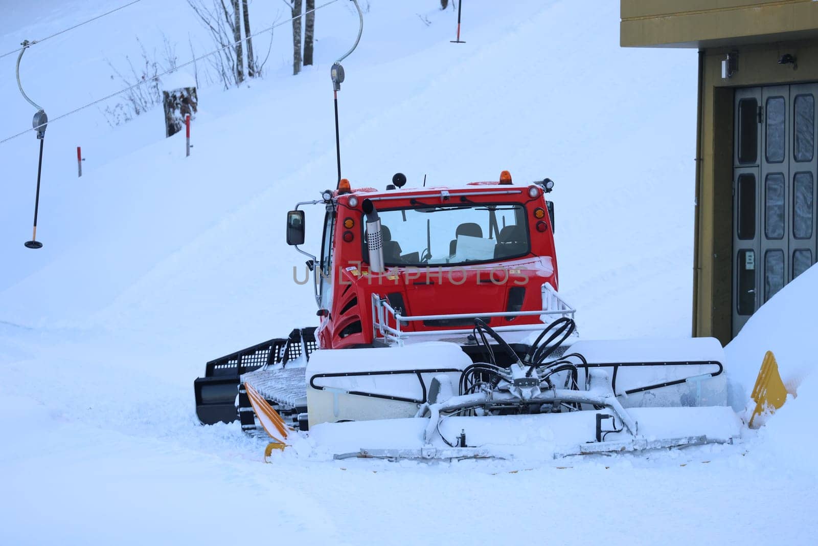 A snow groomer is ready for use at Grafenmatt / Feldberg  First onset of winter in Germany.   In the Upper Black Forest,as here on the Feldberg (Breisgau-Hochschwarzwald district),there were the first heavy snowfalls on Tuesday with the cold air and temperatures below freezing point - on Wednesday the landscape presented itself in its best white winter dress. Sugar-covered fir trees with a snow depth of a good 40 centimetres,sunshine attracted the first winter sports enthusiasts to the highest elevation in the country. On the first weekend in December,the winter sports season on the Feldberg is to be opened.
