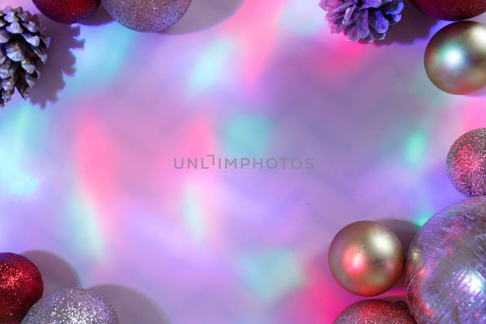 christmas balls on a background of colored lights and bokeh.