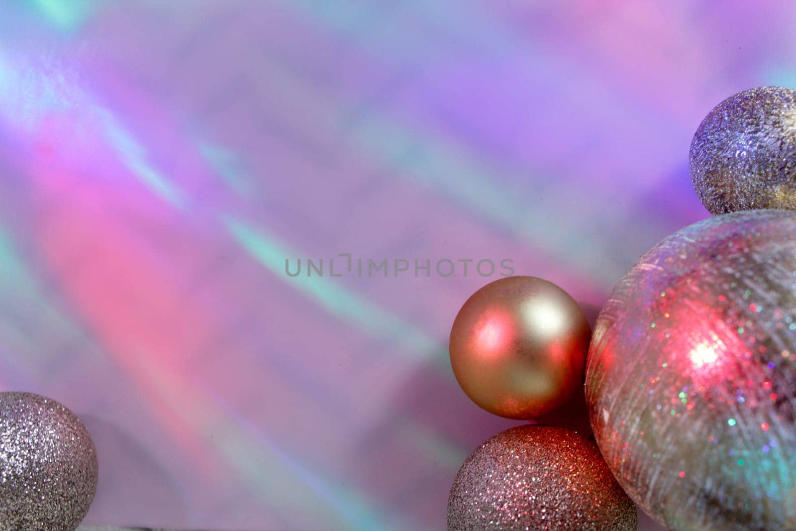 christmas balls on a background of colored lights and bokeh.