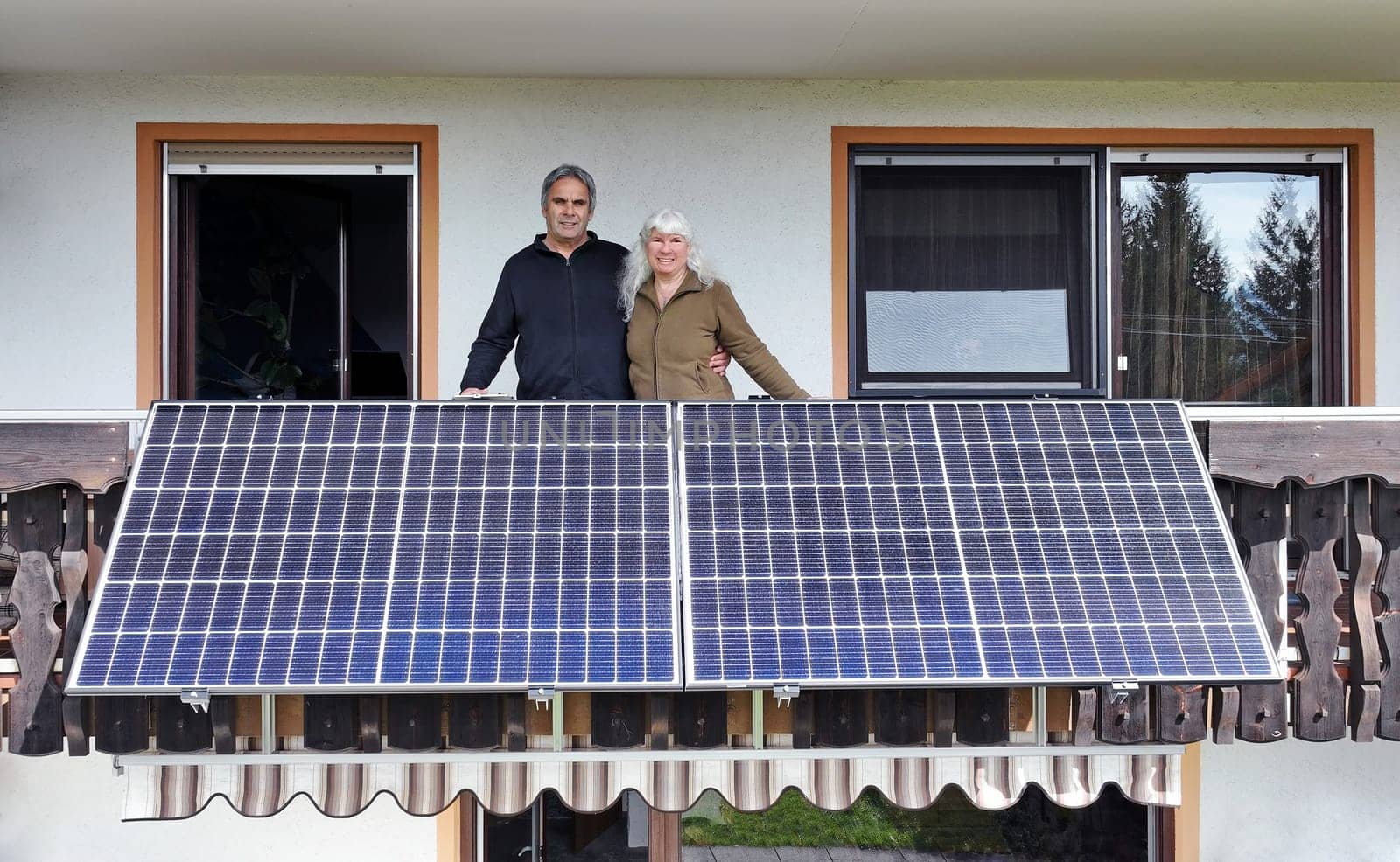 A woman and her husband are happy about the new balcony power plant