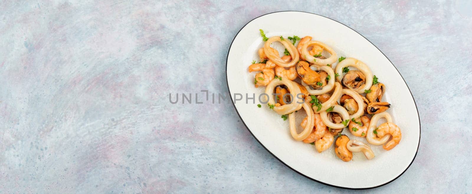 Roasted mussels, squid and shrimp. Seafood plate