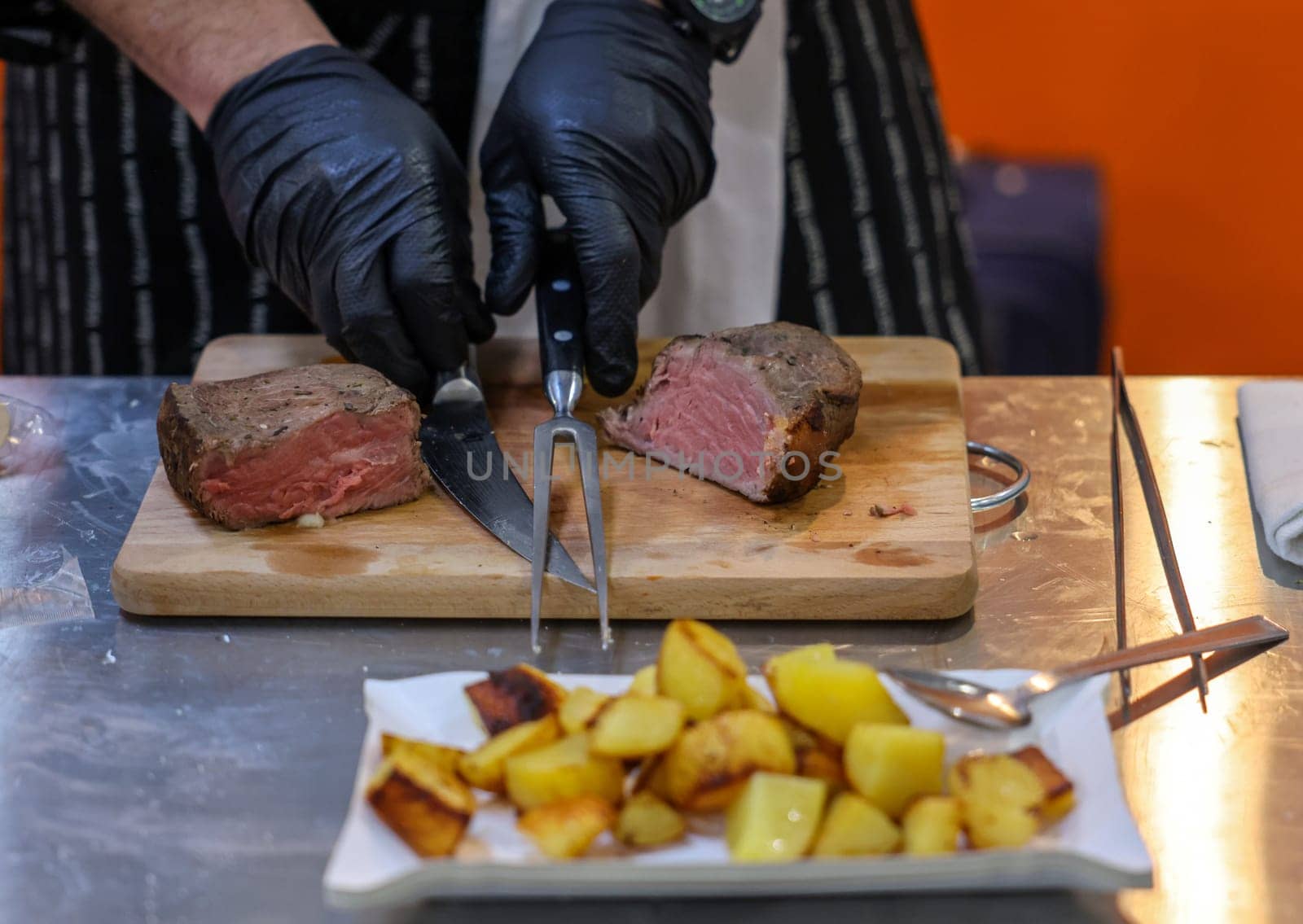 Grilled beef tenderloin on a wooden kitchen board, ready to eat