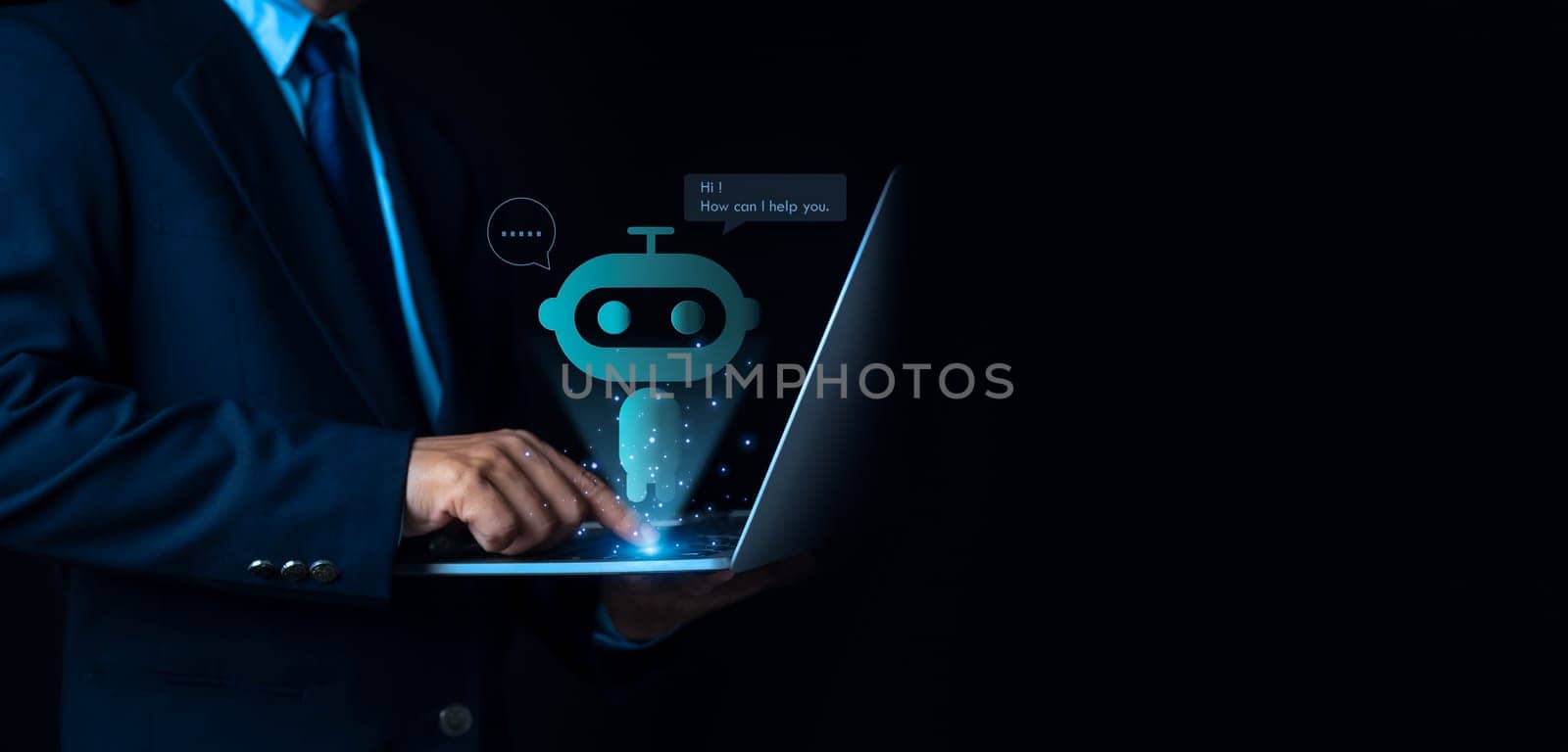 Businessman uses computer to type chat Ask and answer with the artificial intelligence system, chatbot, AI assistant.