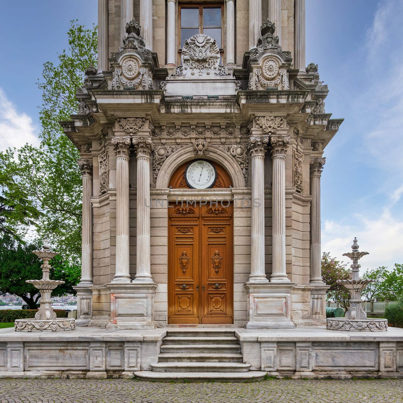 Entranceof Dolmabahce Clock Tower, or Dolmabahce Saat Kulesi, situated outside Dolmabahce Palace, Istanbul, Turkey, in a spring day