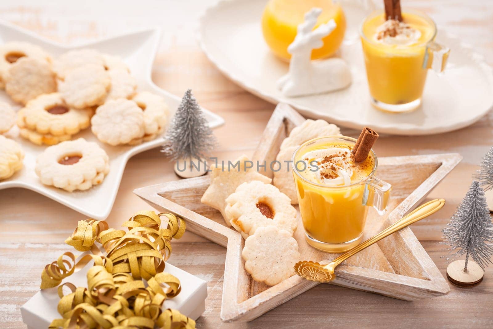 Homemade eggnog, egg liqueur for Christmas with small cookies
