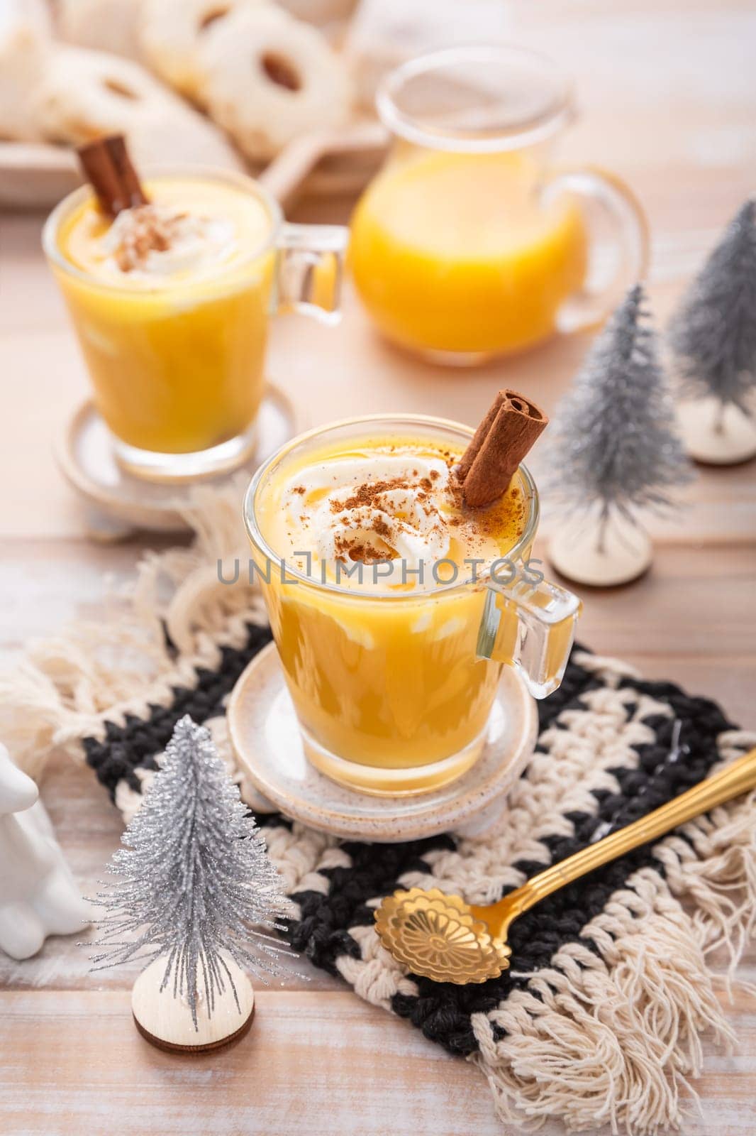 Homemade eggnog, egg liqueur for Christmas with small cookies