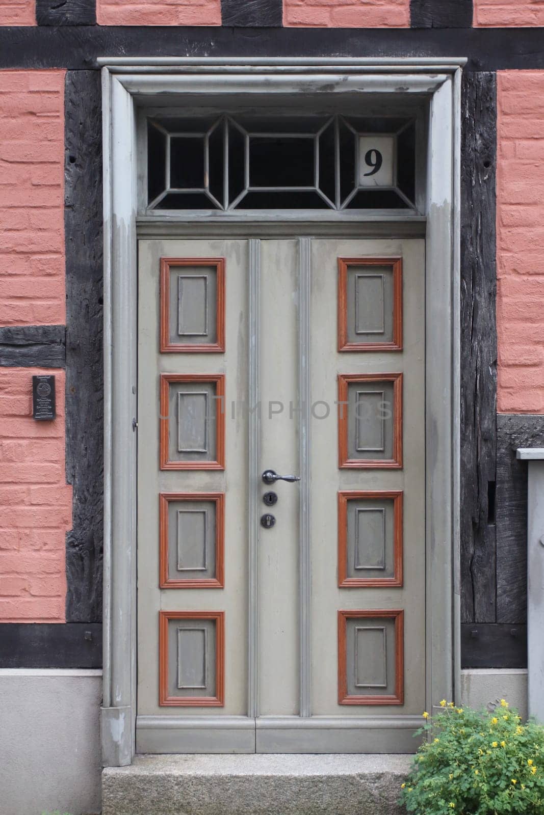 A detailed  picture of a restored, ornately decorated old front door