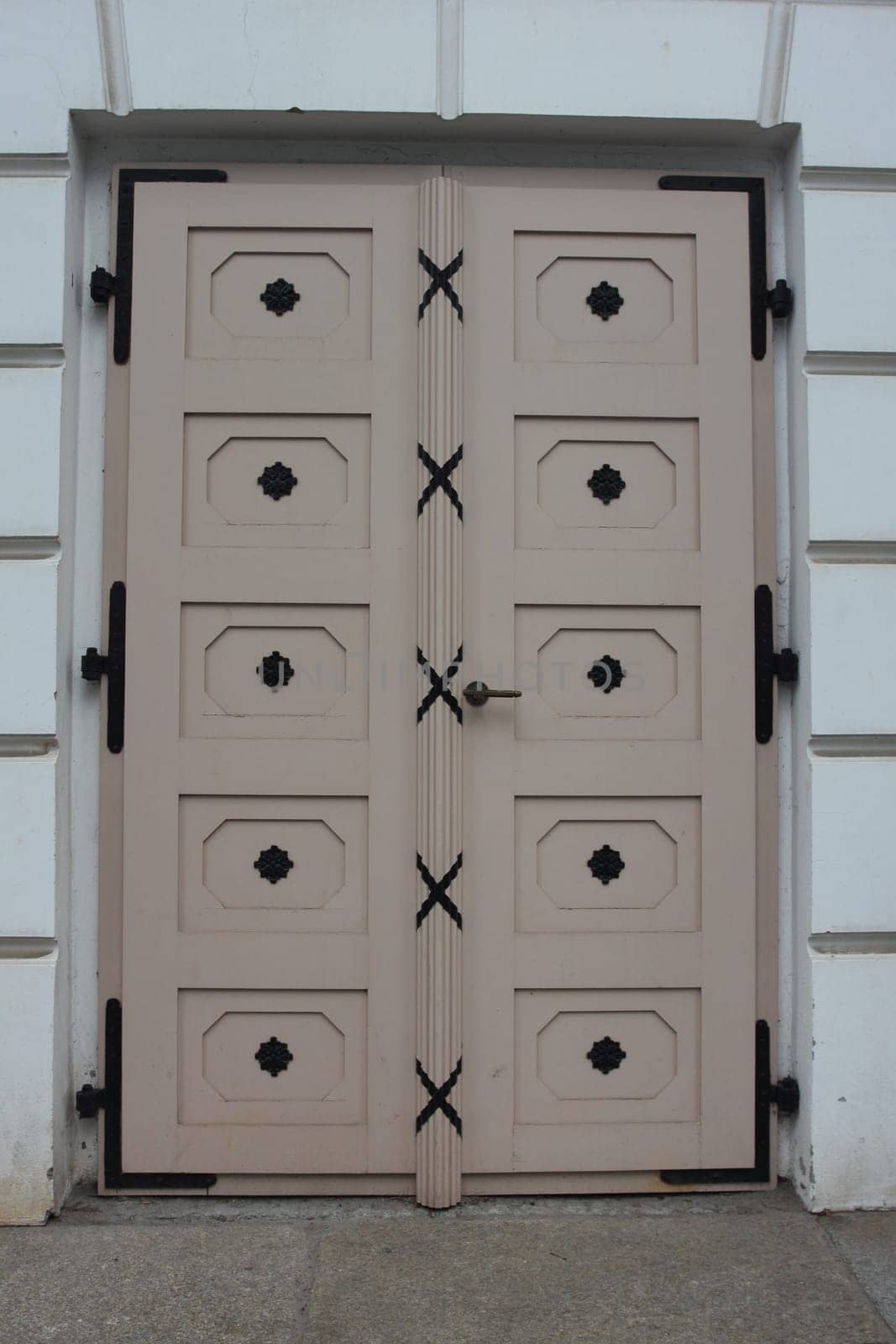 A detailed  picture of a restored, ornately decorated old front door