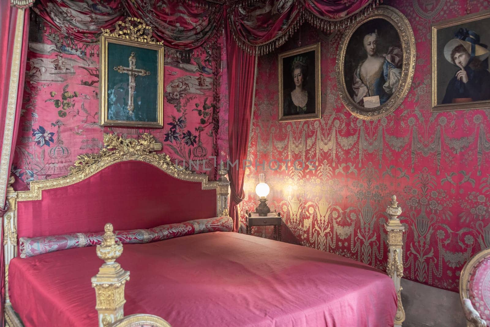 Masino, Italy - April 2023: baroque bedroom in old castle. Vintage interior, original from 18th Century
