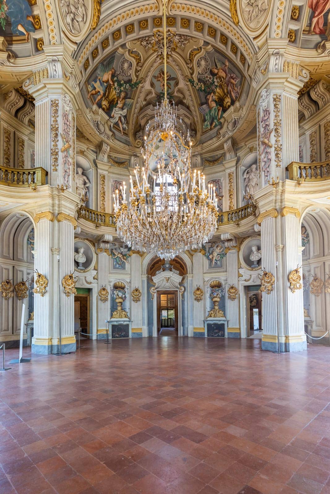 Italy, Stupinigi - January 2023: luxury interior of Royal Palace with baroque marbles and windows