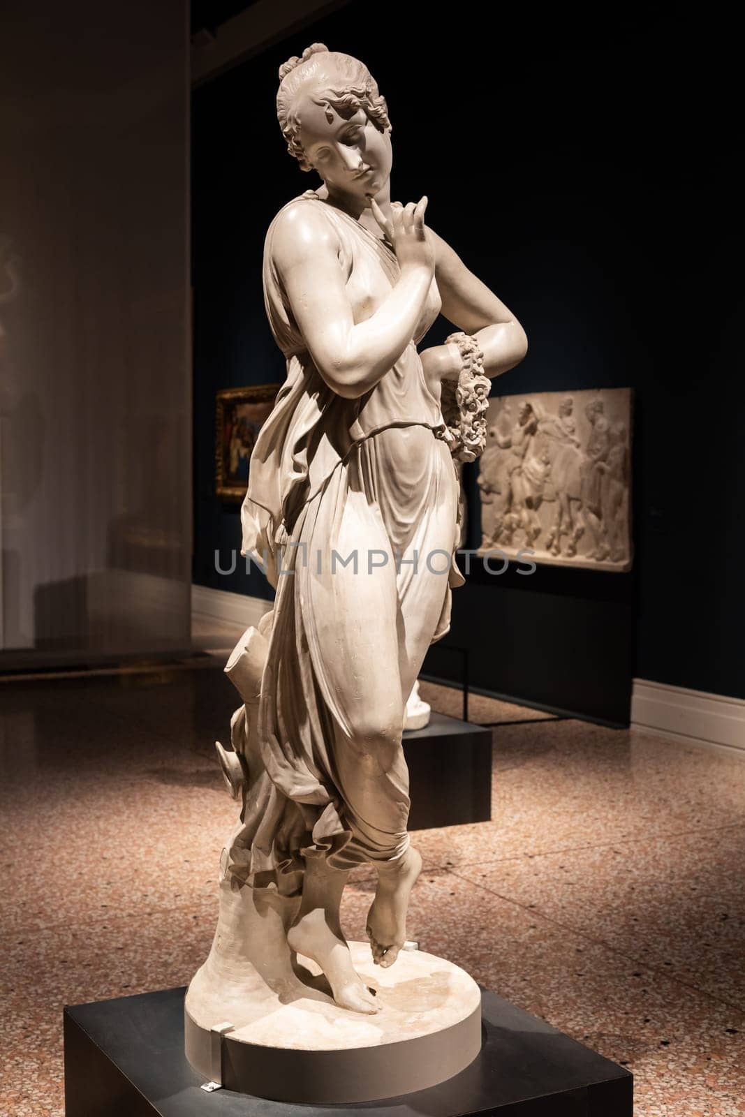 Bassano del Grappa, Italy - December 2022: Dancer with finger on her chin, by Antonio Canova, 1814. Classic statue, Roman beauty