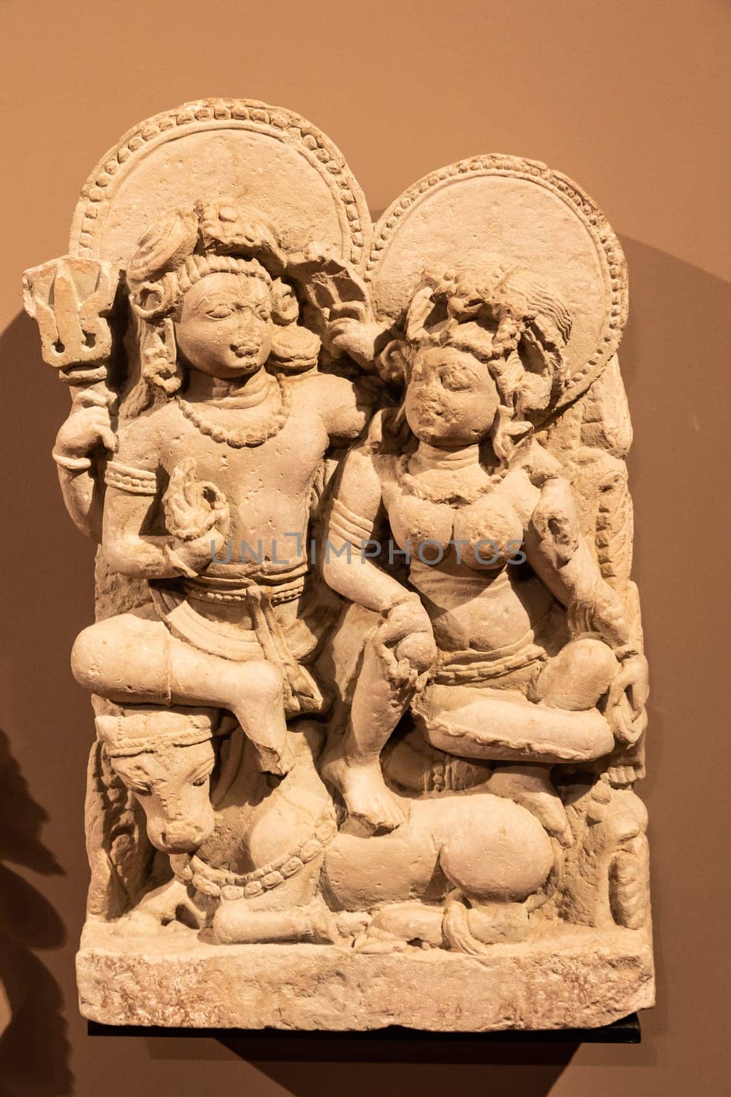 Turin, Italy - May 2023: Oriental Art Museum - Shiva, the Hindu god, with his wife Parvati. Concept for tantra, Kamasutra, tantric sex